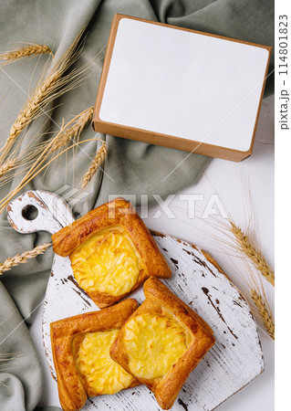 Blank box with homemade cheese tarts 114801823