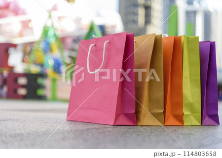 Shopping bags of women crazy shopaholic person at fashion shopping mall indoor. Fashionable Woman love online shopping website with sales tag. E-commerce digital marketing happy city lifestyle person Shopping bags of women crazy shopaholic person at fashion shopping mall indoor. Fashionable Woman love online shopping website with sales tag. E-commerce digital marketing happy city lifestyle person 114803658