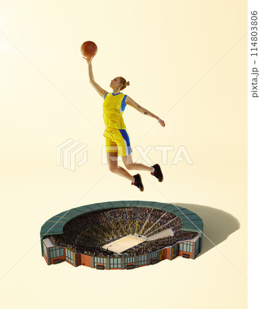 3D render. Dynamic image of young girl in yellow uniform with ball, basketball player during game above stadium. Creative collage. 114803806