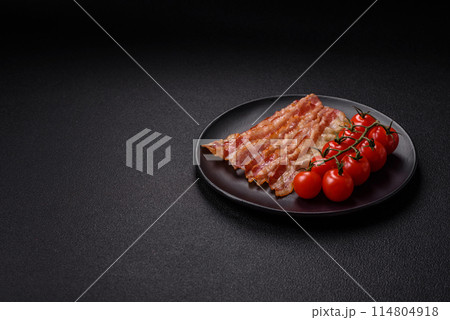 Delicious bacon in the form of slices with salt, spices and herbs 114804918