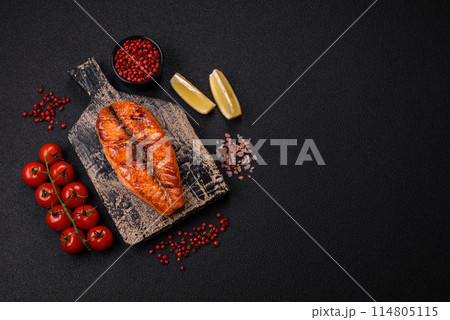 Fresh cooked delicious salmon steak with spices and herbs Fresh cooked delicious salmon steak with spices and herbs 114805115