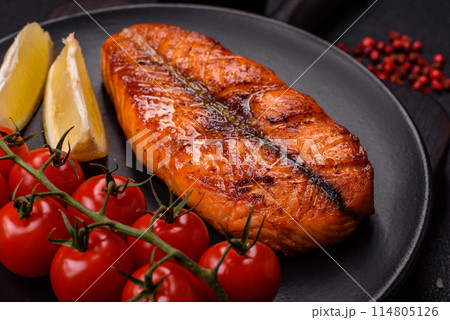 Fresh cooked delicious salmon steak with spices and herbs 114805126