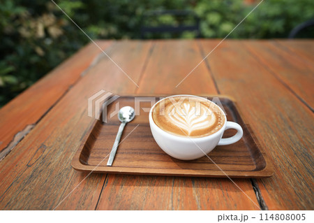 White coffee cup and spoon on red wooden table 114808005