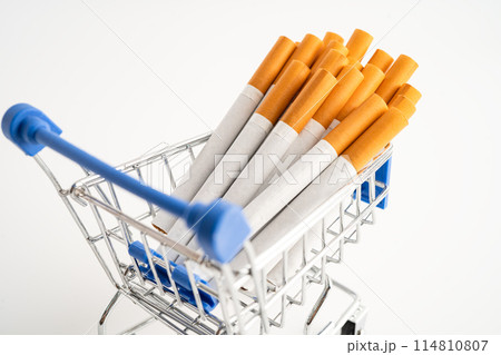 Cigarette on US dollar banknotes, cost, trading, marketing and production, No smoking, imort export concept. Cigarette on US dollar banknotes, cost, trading, marketing and production, No smoking, imort export concept. 114810807
