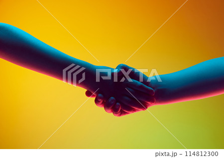 Children hands gesturing, kids shaking hands against gradient green yellow background in neon light. Children hands gesturing, kids shaking hands against gradient green yellow background in neon light. 114812300