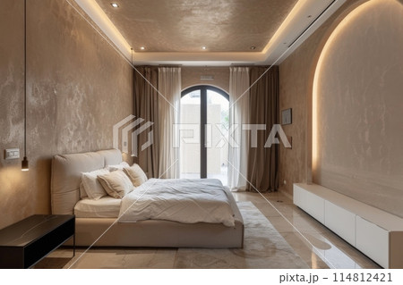 The bedroom has a spacious bed and a big window for natural light 114812421