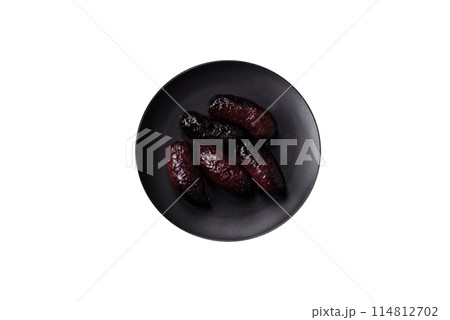 Delicious black blood sausage or black pudding with spices and herbs Delicious black blood sausage or black pudding with spices and herbs 114812702
