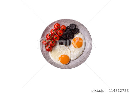 English breakfast with fried eggs, bacon, beans, tomatoes, spices and herbs English breakfast with fried eggs, bacon, beans, tomatoes, spices and herbs 114812728