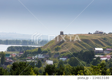 The tower of an ancient Bulgarian fortress on a high cliff on the banks of the Kama River, Elabuga, Tatarstan, Russian Federation 114813180