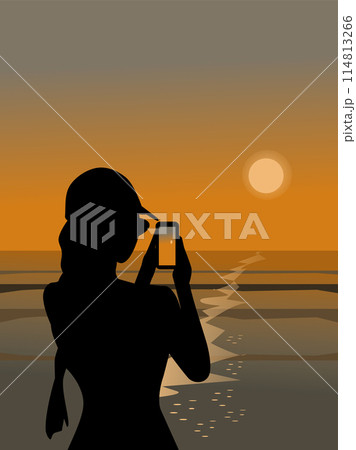 Silhouette of a woman using a mobile phone to take pictures of the sunset by the sea Silhouette of a woman using a mobile phone to take pictures of the sunset by the sea 114813266