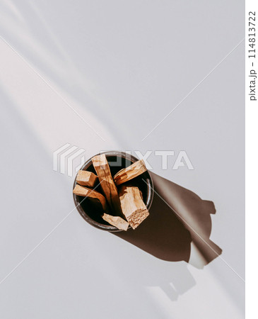 Wooden sticks Palo Santo in black box on light background. Aromatherapy and religious rites and meditations. 114813722