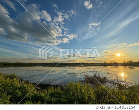 Wide river, horizon, clouds are reflected in the water. Wide river, horizon, clouds are reflected in the water. 114815154