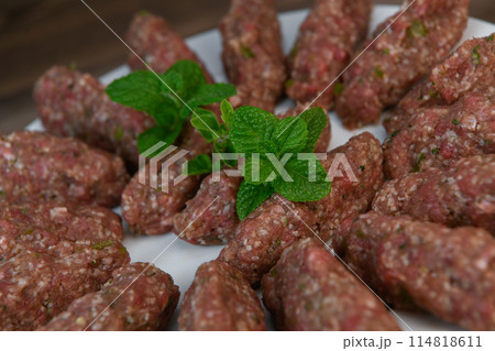 RECIPE FOR LEBANESE KEBBE NAYYHE, RAW MINCED BEEF, MARJORAM, MINT, ONIONS, CRUSHED WHEAT, SEVEN RECIPE FOR LEBANESE KEBBE NAYYHE, RAW MINCED BEEF, MARJORAM, MINT, ONIONS, CRUSHED WHEAT, SEVEN 114818611