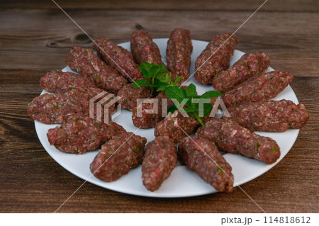 RECIPE FOR LEBANESE KEBBE NAYYHE, RAW MINCED BEEF, MARJORAM, MINT, ONIONS, CRUSHED WHEAT, SEVEN RECIPE FOR LEBANESE KEBBE NAYYHE, RAW MINCED BEEF, MARJORAM, MINT, ONIONS, CRUSHED WHEAT, SEVEN 114818612