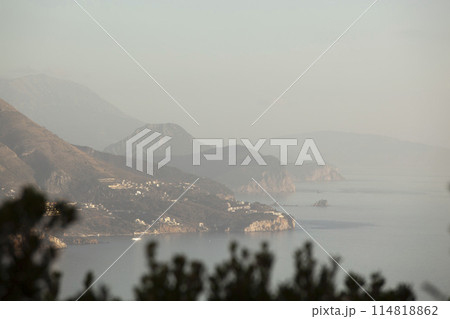Spring in the mountains, beautiful mountain landscape. View of a mountain range and green trees. Landscape in the haze. Sands of the Sahara. Budva, Montenegro. Europe. Horizontal 114818862