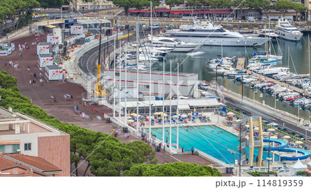 Seaside swimming pool in Monaco timelapse, with people and buildings in the background. Seaside swimming pool in Monaco timelapse, with people and buildings in the background. 114819359