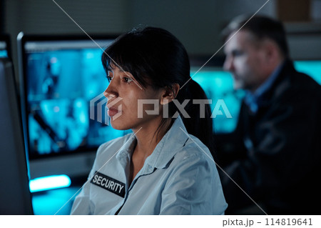 Security working in surveillance room Security working in surveillance room 114819641