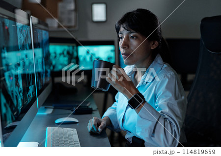 Young security guard with cup of coffee Young security guard with cup of coffee 114819659