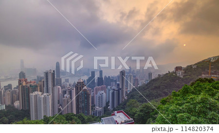The famous view of Hong Kong from Victoria Peak timelapse. Taken at sunrise while the sun climbs over Kowloon Bay. 114820374