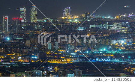 Barcelona and Badalona skyline with roofs of houses and sea on the horizon day to night timelapse 114820505