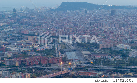 Barcelona and Badalona skyline with roofs of houses and sea on the horizon day to night timelapse 114820506