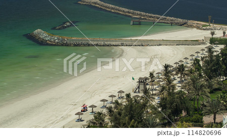 Beautiful area of beach in Ajman timelapse near the turquoise waters of Arabian Gulf. Beautiful area of beach in Ajman timelapse near the turquoise waters of Arabian Gulf. 114820696