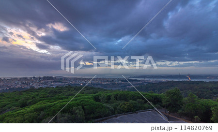Panoramic sunrise view over Lisbon and Almada from a viewpoint in Monsanto morning timelapse. 114820769