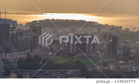 Panoramic overview during sunrise over Lisbon from a viewpoint in Monsanto morning timelapse. 114820773