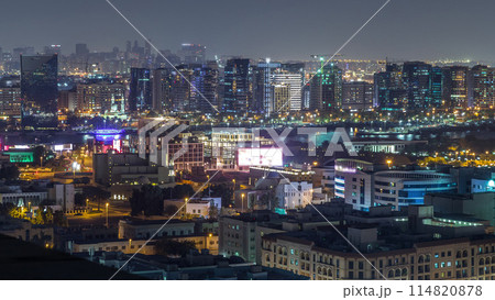 Aerial view of neighborhood Deira with typical buildings night timelapse, Dubai, United Arab Emirates Aerial view of neighborhood Deira with typical buildings night timelapse, Dubai, United Arab Emirates 114820878