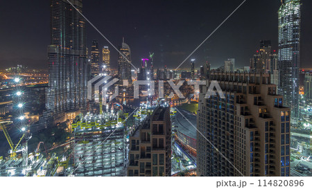 Panoramic skyline view of Dubai downtown before sunrise with mall, fountains and skyscrapers aerial night to day timelapse 114820896