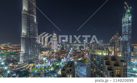 Panoramic skyline view of Dubai downtown with mall, fountains and skyscrapers aerial night timelapse Panoramic skyline view of Dubai downtown with mall, fountains and skyscrapers aerial night timelapse 114820899