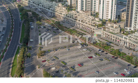 Aerial view full cars at large outdoor parking lots timelapse in Dubai, UAE. 114820981