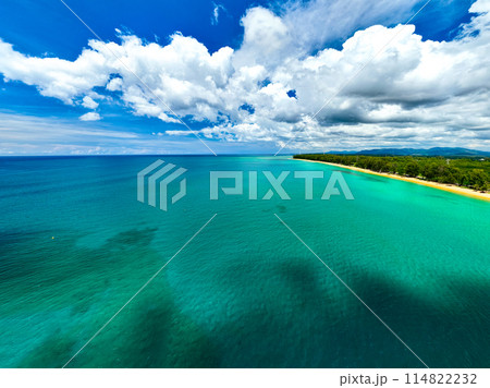 Aerial view of a blue sea surface water texture background,Sun reflections over ocean, Aerial flying drone view Waves water surface texture on sunny tropical ocean in Phuket island Thailand Aerial view of a blue sea surface water texture background,Sun reflections over ocean, Aerial flying drone view Waves water surface texture on sunny tropical ocean in Phuket island Thailand 114822232