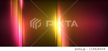 A vibrant pink and yellow light beam illuminates a dark background 114826434