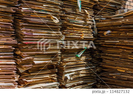 Stacks of crushed cardboard boxes, full-frame closeup background Stacks of crushed cardboard boxes, full-frame closeup background 114827132