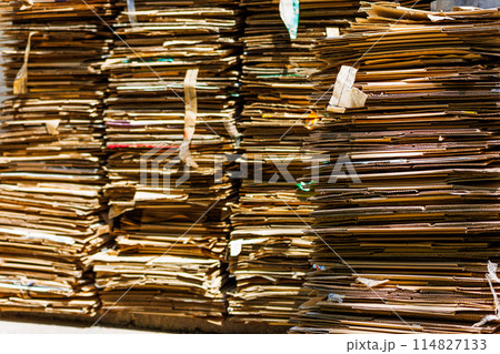 Stacks of crushed cardboard boxes, full-frame closeup background Stacks of crushed cardboard boxes, full-frame closeup background 114827133
