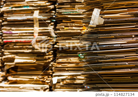 Stacks of crushed cardboard boxes, full-frame closeup background Stacks of crushed cardboard boxes, full-frame closeup background 114827134