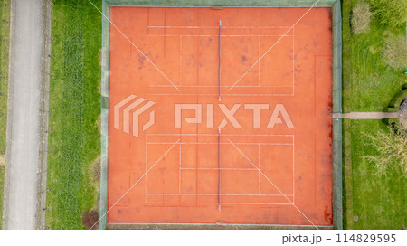 Aerial view of tennis court with wood flooring and brickwork Aerial view of tennis court with wood flooring and brickwork 114829595