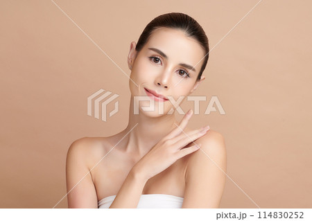 Beautiful young asian woman with clean fresh skin on beige background, Face care, Facial treatment, Cosmetology, beauty and spa, Asian women portrait. 114830252