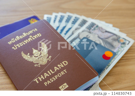 Passport, airline tickets or boarding pass, cash and credit cards for international business and leisure travel. Passport, airline tickets or boarding pass, cash and credit cards for international business and leisure travel. 114830743