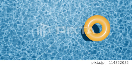 Summer holidays banner. Swimming pool top view. Yellow swimming ring in the empty clear pool. Summer holidays banner. Swimming pool top view. Yellow swimming ring in the empty clear pool. 114832083
