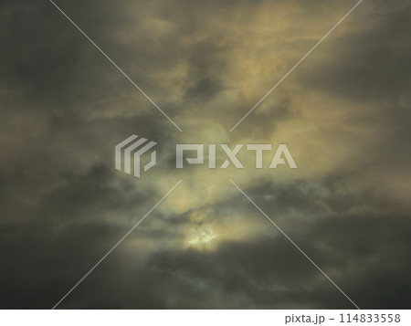 Dramatic cloudy sky with sunlight breaking through 114833558