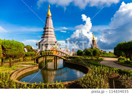 Beautiful landscape aerial view of Doi Inthanon in evening time with blue sky background buddhist stupa landmark tourism at Chiang Mai of north Thailand. Beautiful landscape aerial view of Doi Inthanon in evening time with blue sky background buddhist stupa landmark tourism at Chiang Mai of north Thailand. 114834035