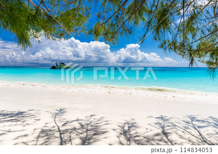 Sky and white sandy beach with trees and boats at Koh Tachai Simiranthai Islands National Park 114834053