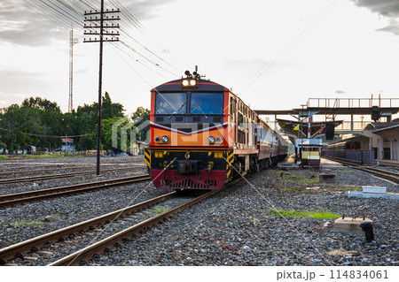 Classic diesel trains transport passengers and tourists in Thailand at railway junctions. 114834061