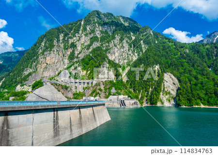 Kurobe Dam is a large dam in the middle of a valley in Ashikuraji, Nakanikawa gun, Tateyama-machi, Toyama Prefecture Japan Kurobe Dam is a large dam in the middle of a valley in Ashikuraji, Nakanikawa gun, Tateyama-machi, Toyama Prefecture Japan 114834763