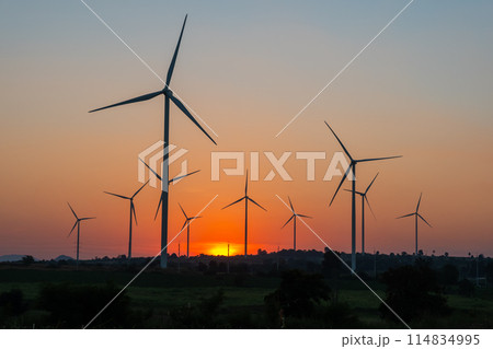Landscape Windmill on a mountain with vast meadows at sunset, beautifully illuminated. 114834995