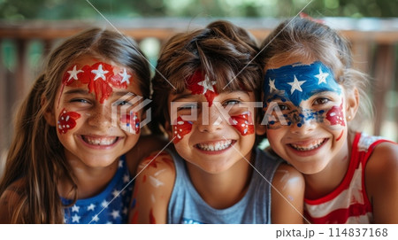 Children with face painting in the colors of the American flag smiling. Holiday celebration in school 114837168