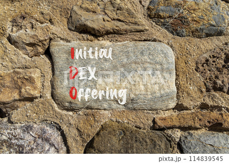 IDO initial DEX offering symbol. Concept words IDO initial DEX offering on beautiful big stone. Beautiful stone wall background. Business IDO initial DEX offering concept. Copy space. 114839545