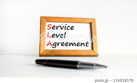 SLA service level agreement symbol. Concept words SLA service level agreement on beautiful wooden frame. Beautiful white background. Business SLA service level agreement concept. Copy space. 114839576